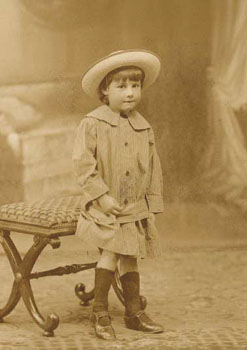 This portrait of a little girl shows her wearing her Sunday Best. All the Society's children had a set of 'best' clothes to go to church in. 