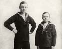 Brothers wearing sailor suits