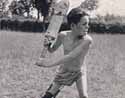 Disabled boy at St. Martin's Home, Purford, playing cricket