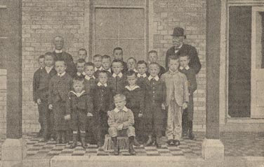 Smartly dressed boys pose outside the Bournemouth Home