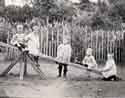 Children playing on a seesaw