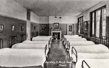 The Cheam Home was built to house over fifty girls, and it contained several big dormitories like this one. Each girl had her own personal space where she could keep her clothes and other possessions.