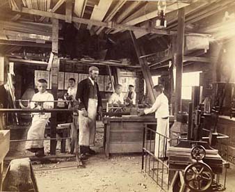 The carpentry workshop at Standon had some advanced machinery, like the treadle lathe on the left of this picture.