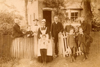 Knebworth Cottage housed only six boys, and it was one of the Society's smallest homes. We believe the man in the middle of the photograph to be the founder of the Home, Mr Jones.